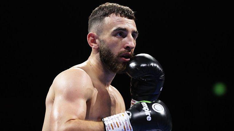 Collins stopped by Davies in seventh round