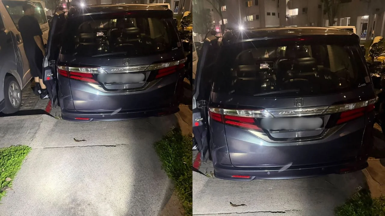Honda Odyssey squeezed into no-parking area outside Yishun HDB block, obstructing access