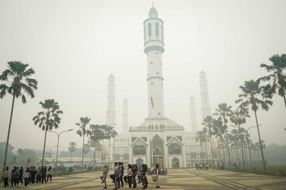 ‘Gift from God’: Rain brings relief from Indonesia toxic haze