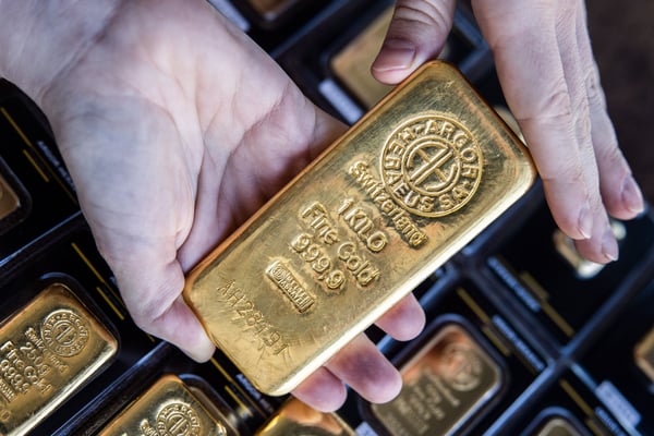 Gold is hovering near a seven-week low as oil keeps Fed rate-hike pressure on