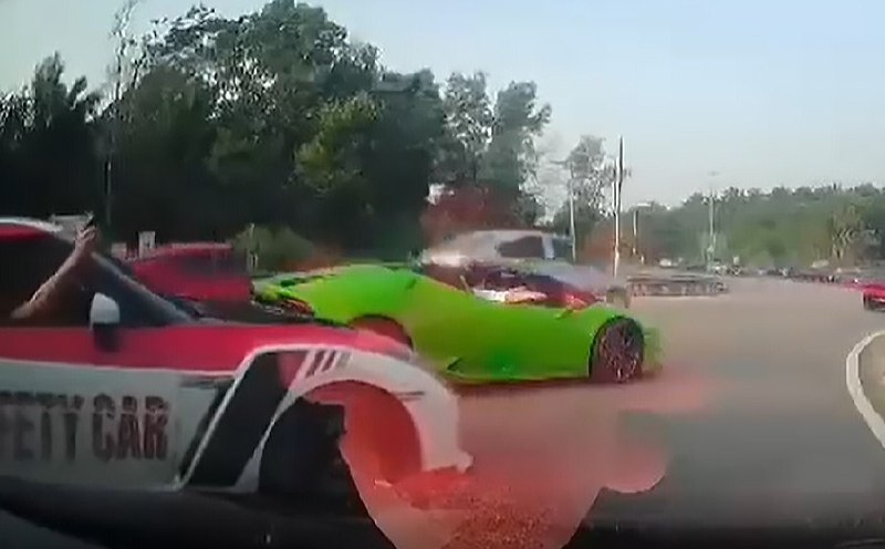 Two drivers held for blocking traffic to let supercar convoy pass