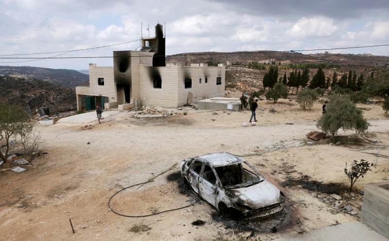 Over 100 Israeli settlers burn Palestinian homes, clash with troops in West Bank