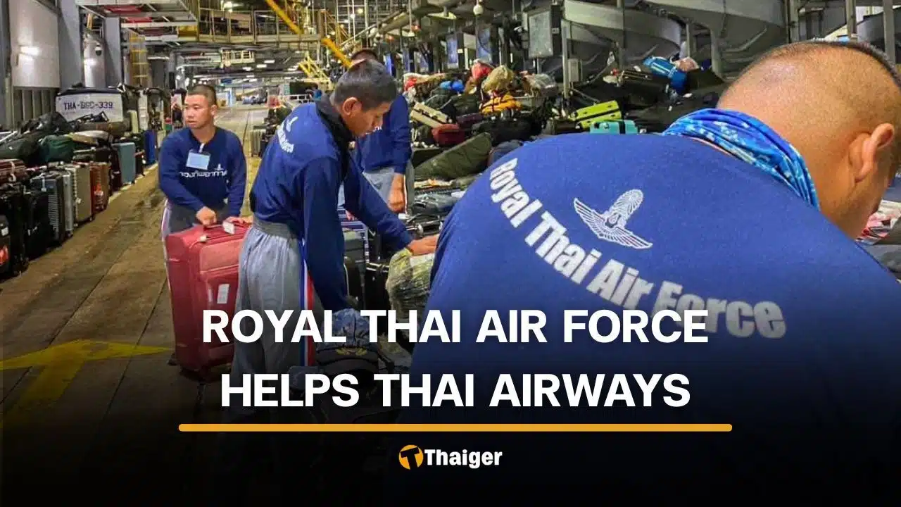 Royal Thai Air Force personnel assist with stranded luggage at Suvarnabhumi Airport