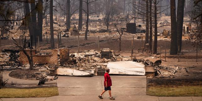 US northwest battles wildfires after Spokane neighborhoods scorched