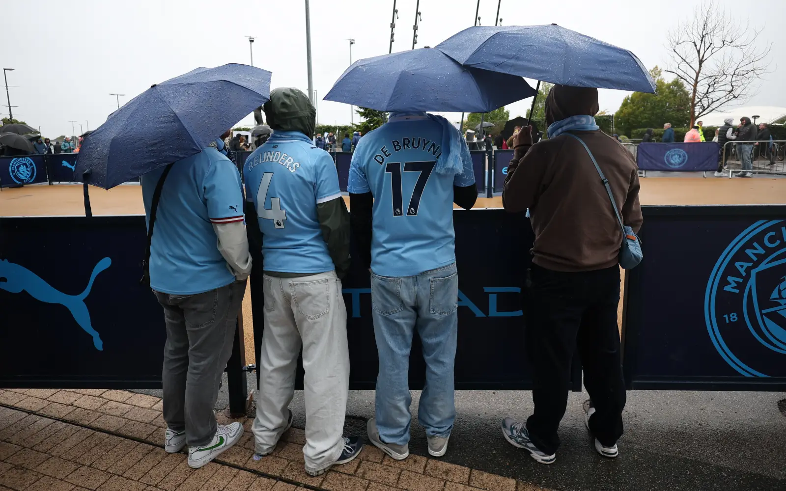 In Manchester, City fans ‘devastated’ while rival fans call for relegation