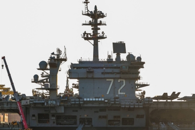 U.S. may add carrier and 10,000 troops to Middle East, official says
