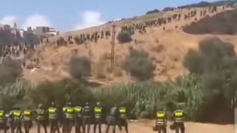 Hundreds of migrants blocked from crossing into Spain