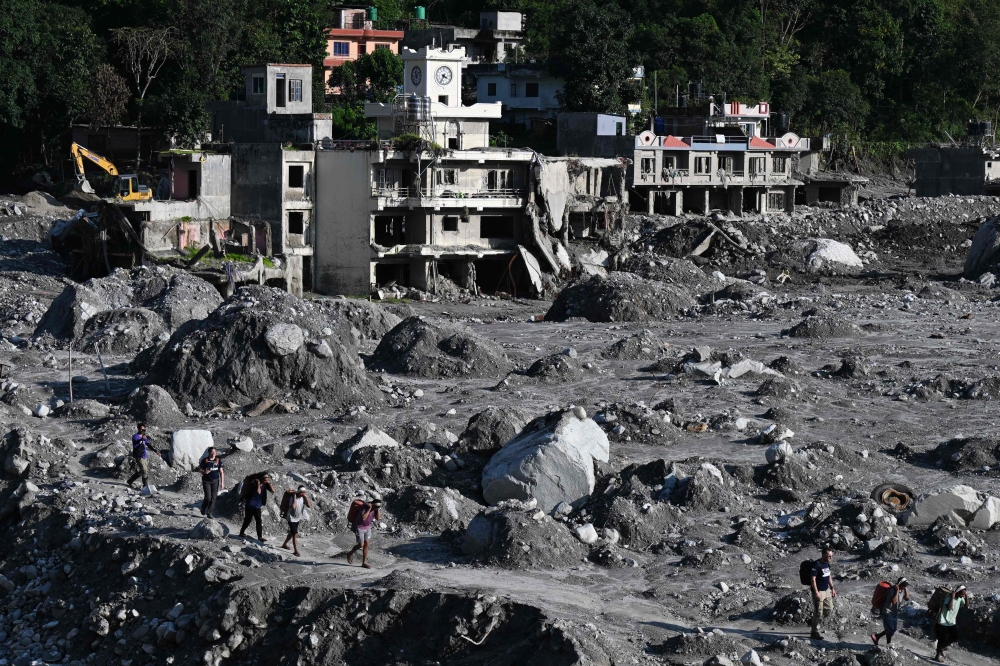 Safe return of solo Malaysian after 37 days in Nepal floods offers hope to 54 still missing