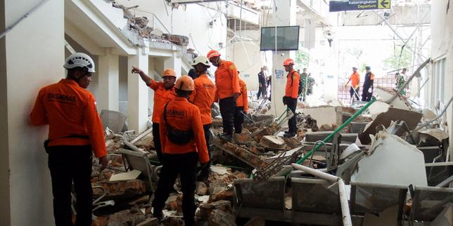 Powerful earthquake strikes Indonesia, killing dozens and triggering landslides