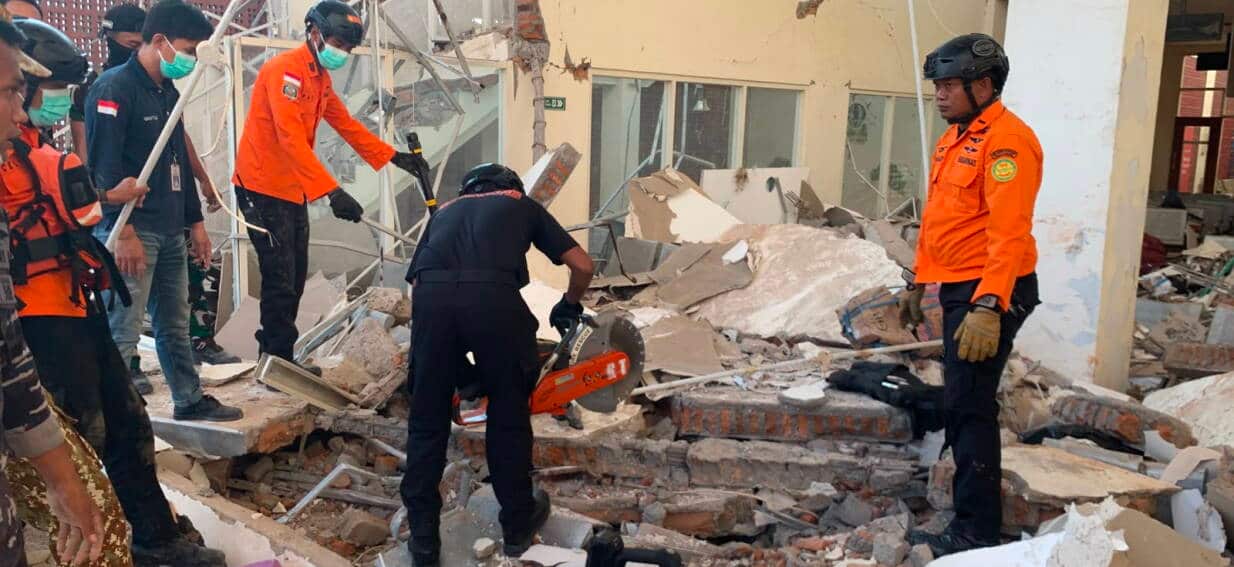 Rescuers search desperately for survivors as Indonesian quake kills dozens of people