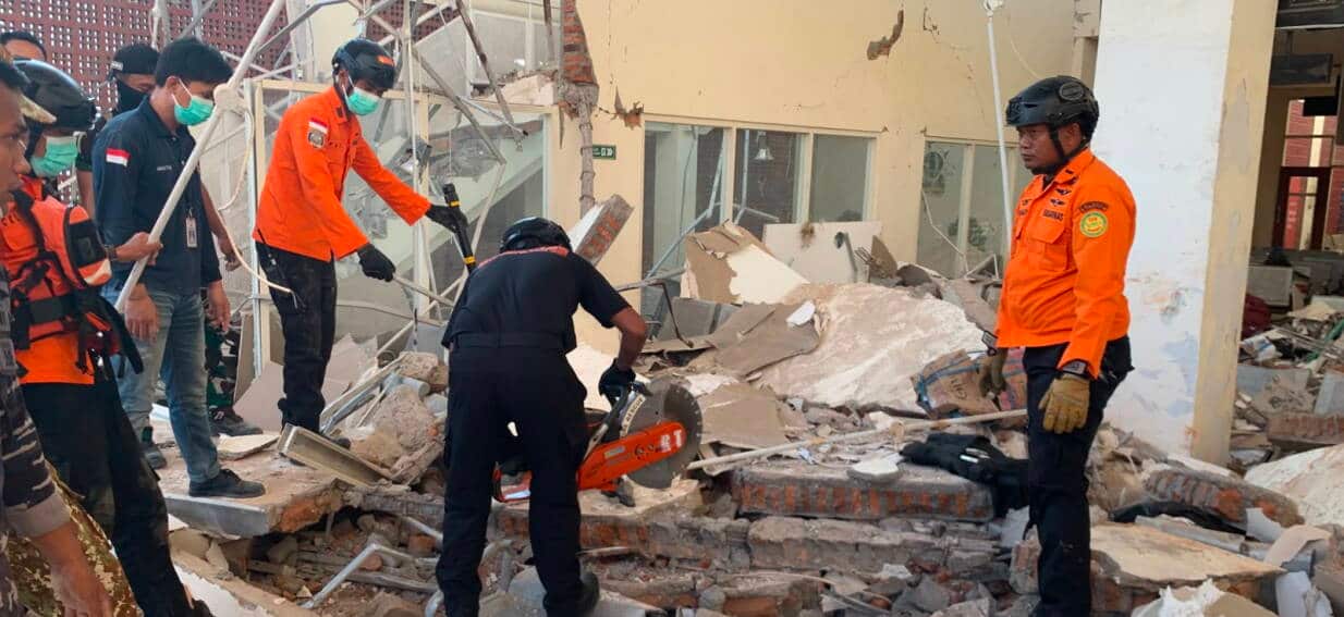 Rescuers search desperately for survivors as Indonesian quake kills dozens of people