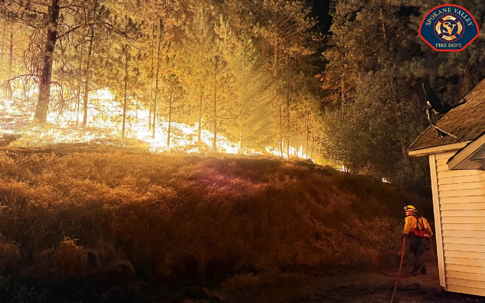 Wildfires near Spokane destroy more than 700 buildings, force 64,000 to flee