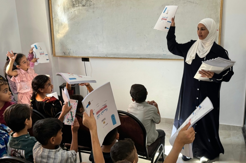 In Egypt, displaced Gazan teacher gives uprooted children a school of their own