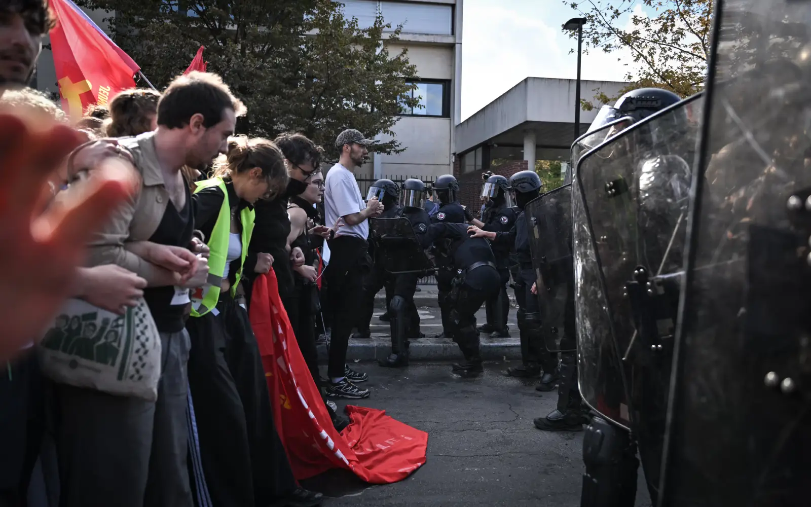 Teenager loses hand picking up grenade in France school protests