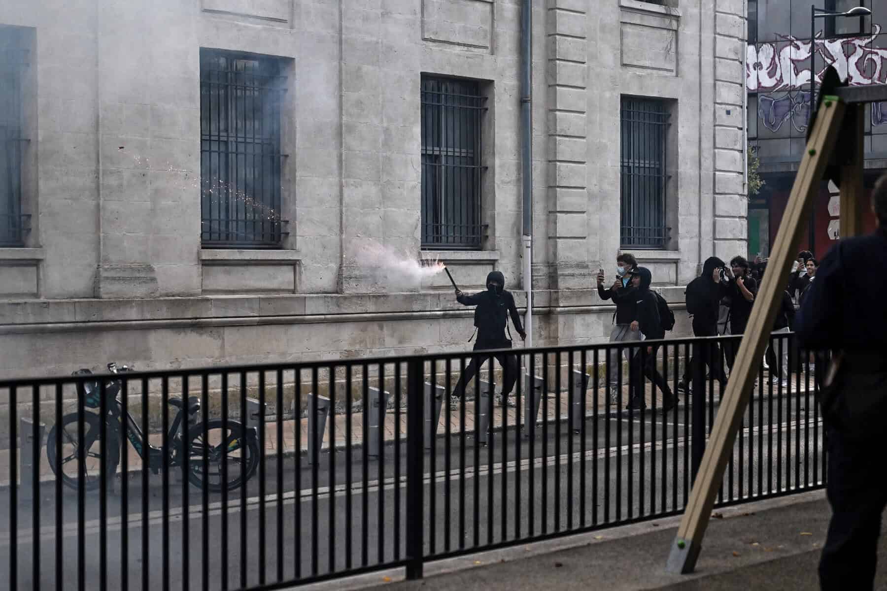 Teenager loses hand picking up grenade in France school protests