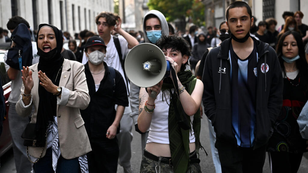 Teenager loses hand picking up grenade in France school protests
