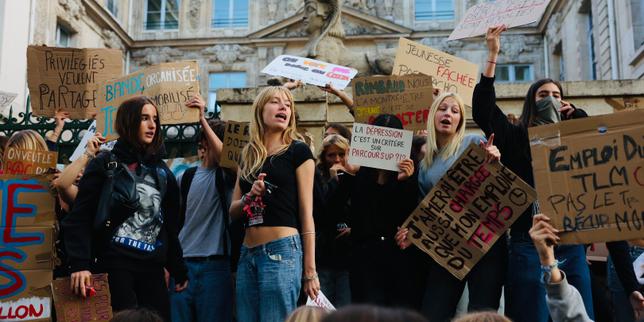 Unions join high school students as tens of thousands demonstrate across France