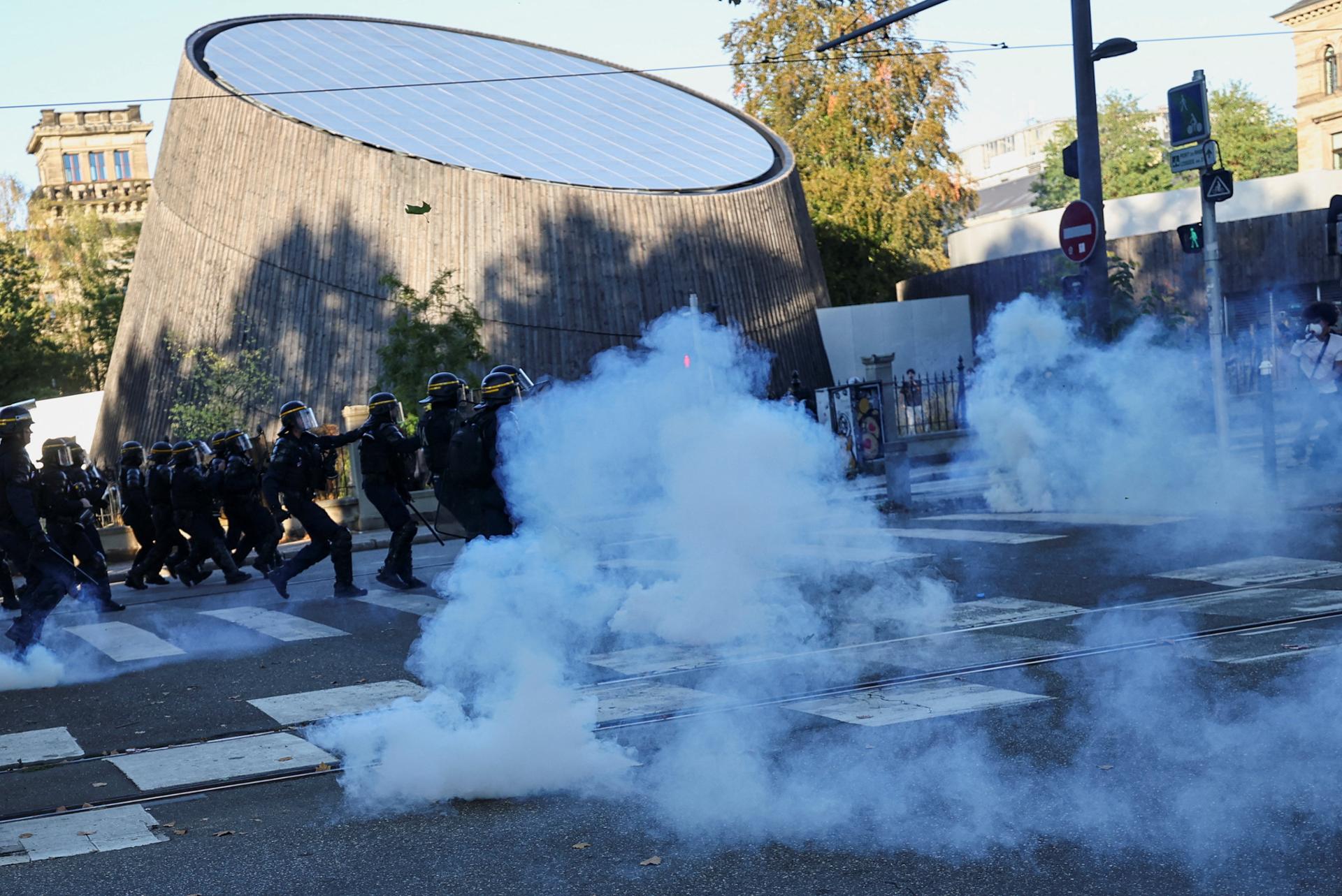 French riot police fire tear gas as more than 250,000 rally nationwide for school funding