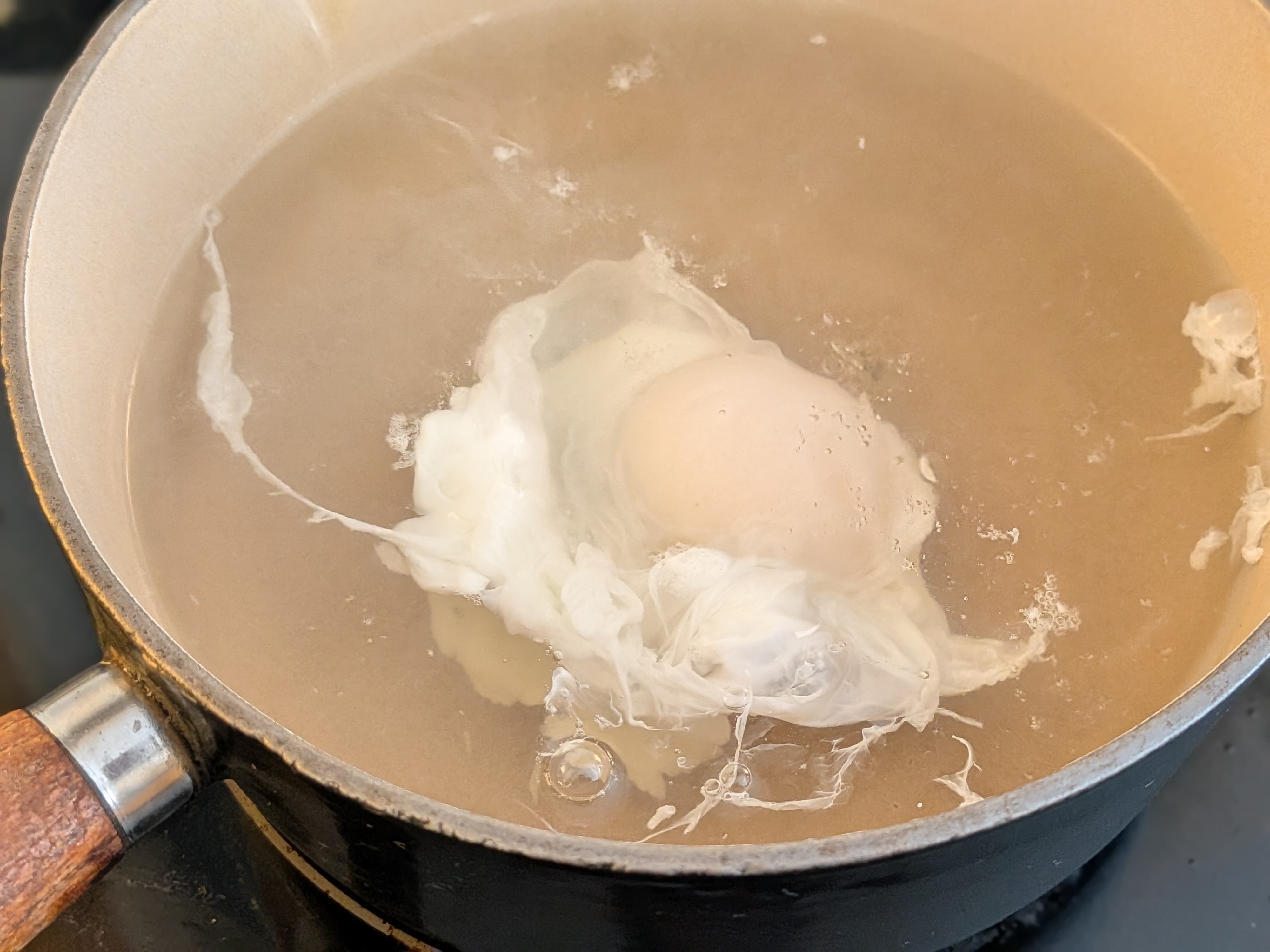 Bid Farewell to Wispy Eggs: This Trick Gives Poached Eggs Perfect Structure Every Time