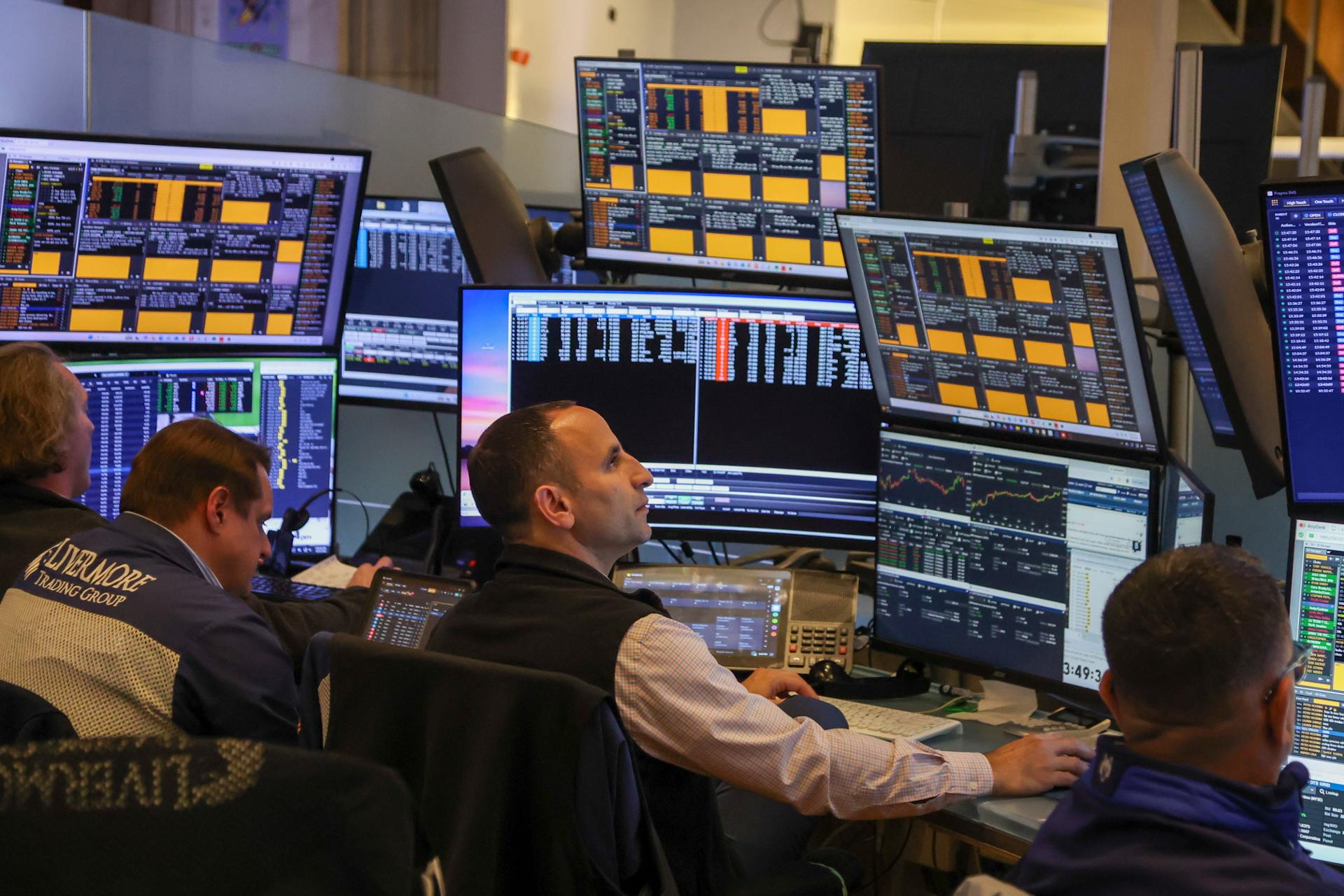 Wall Street retreats from its record as stocks fall worldwide