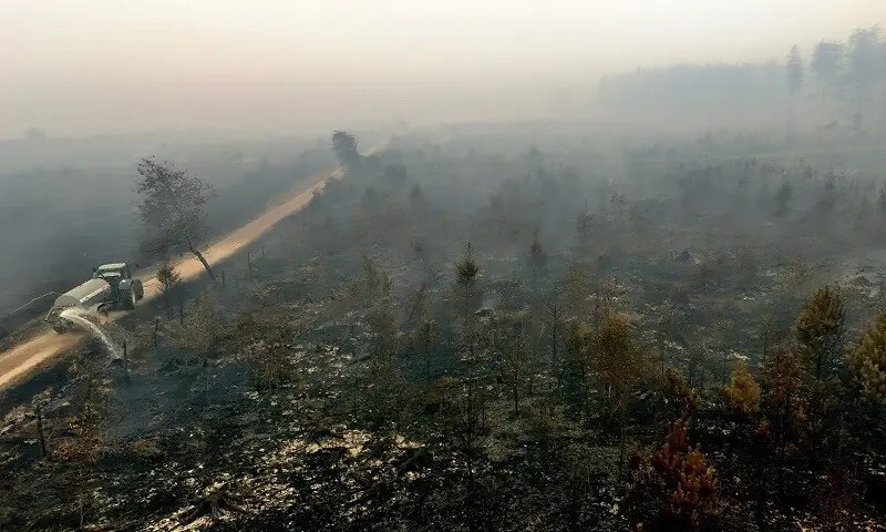 Farmers, helicopters help battle record Belgian wildfire