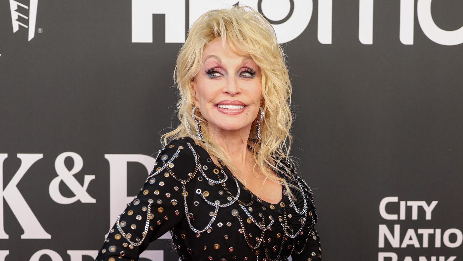 Dolly Parton Misses Dollywood Ride Opening Amid Ongoing “Health Issues”: “See You Down The Road”