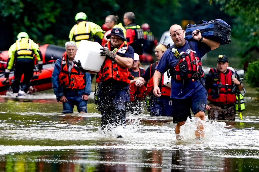At least 6 people have died from days of storms and record-setting flooding in Indiana