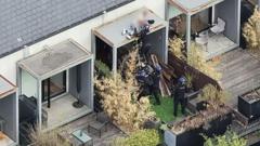 Watch moment police arrest wanted man while he slept on roof