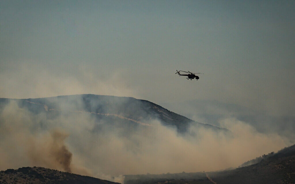 Two dead, hundreds evacuated from fires on island near Athens