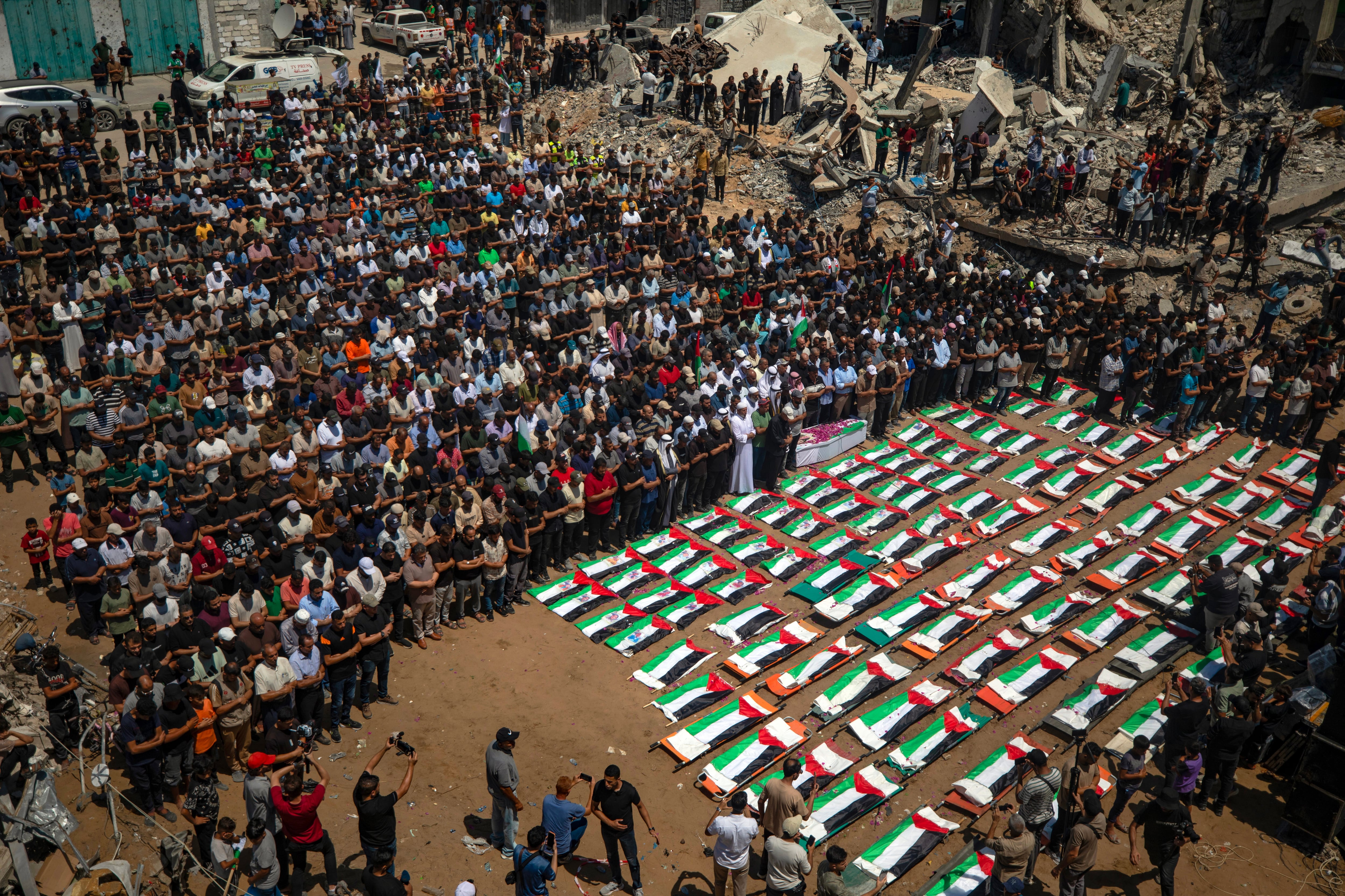 Gazans mourn 112 people retrieved from rubble almost three years after Israeli strike