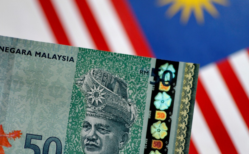 Ringgit opens higher versus greenback on upbeat GDP data