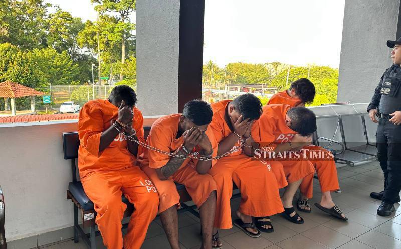 Four charged with murder of businessman found in river