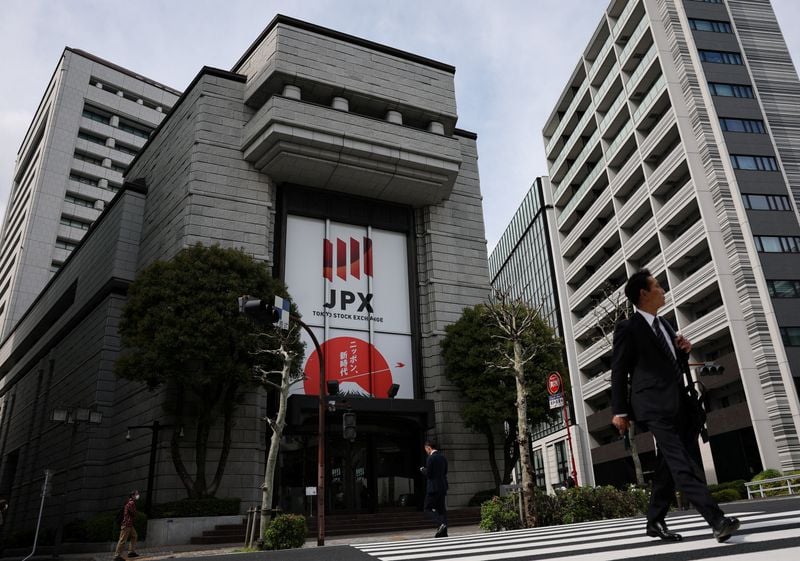 Asian shares rise, dollar slips as markets pare Fed rate risks