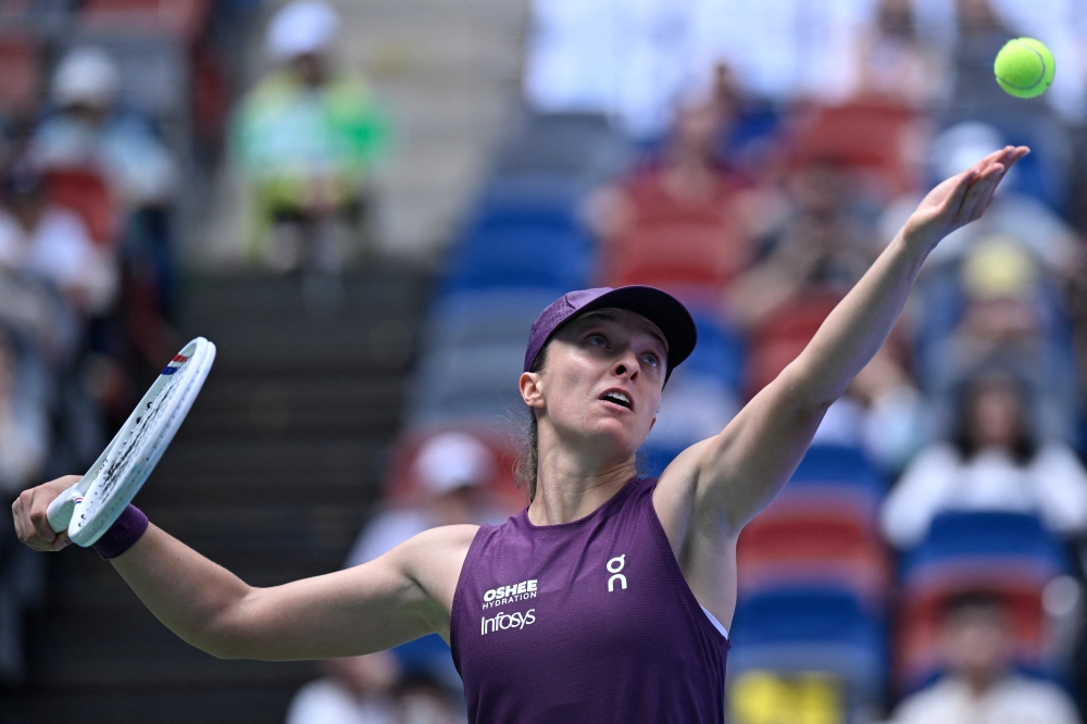 Relentless Swiatek wins all-Polish battle to launch Wuhan campaign
