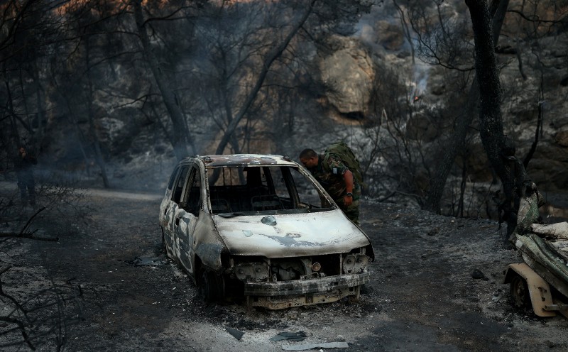 Fires near Greek capital controlled after claiming two lives
