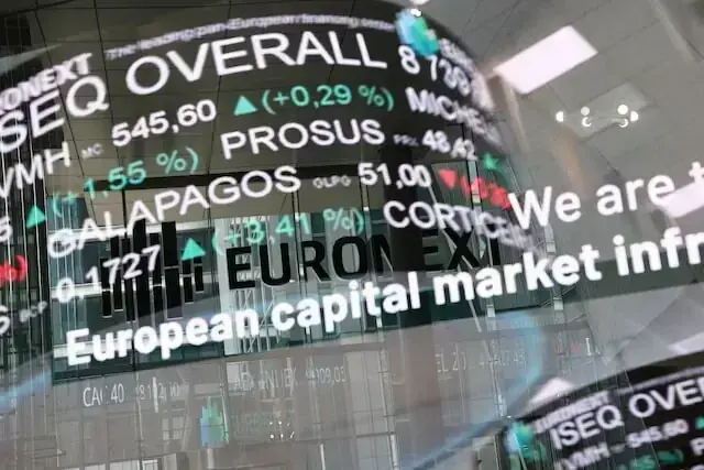 European shares tick higher as easing Fed hike bets lift gold