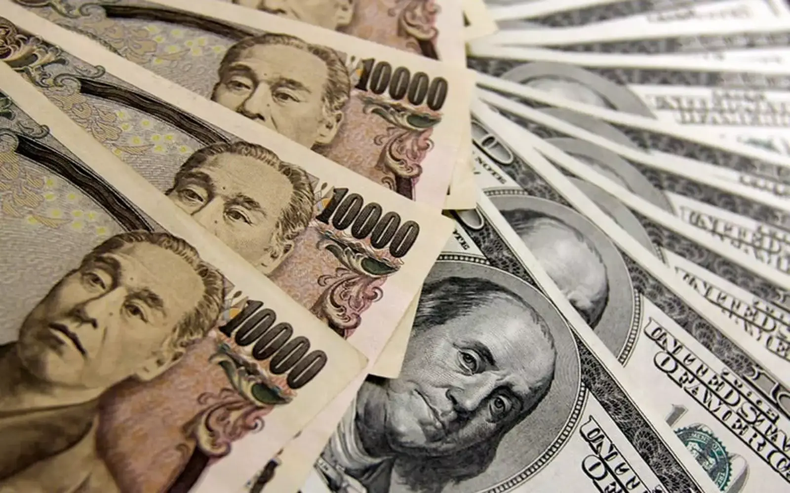 Dollar falls to lowest since early June as rate hike bets fade