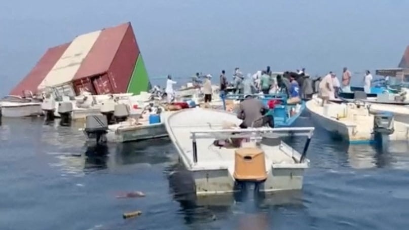 Fire, sinking and reported scramble for cargo: what we know about ship lost in Strait of Hormuz