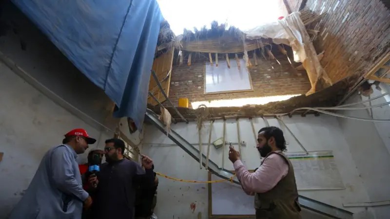 At least 27 children and a teacher killed after school roof collapses in Pakistan
