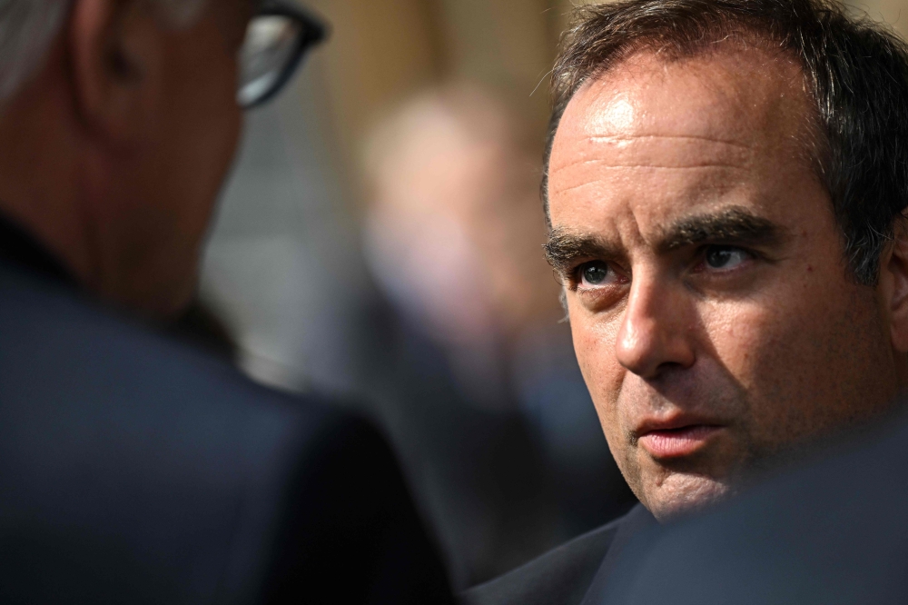 Residents jeer French PM on visit to fire-hit region