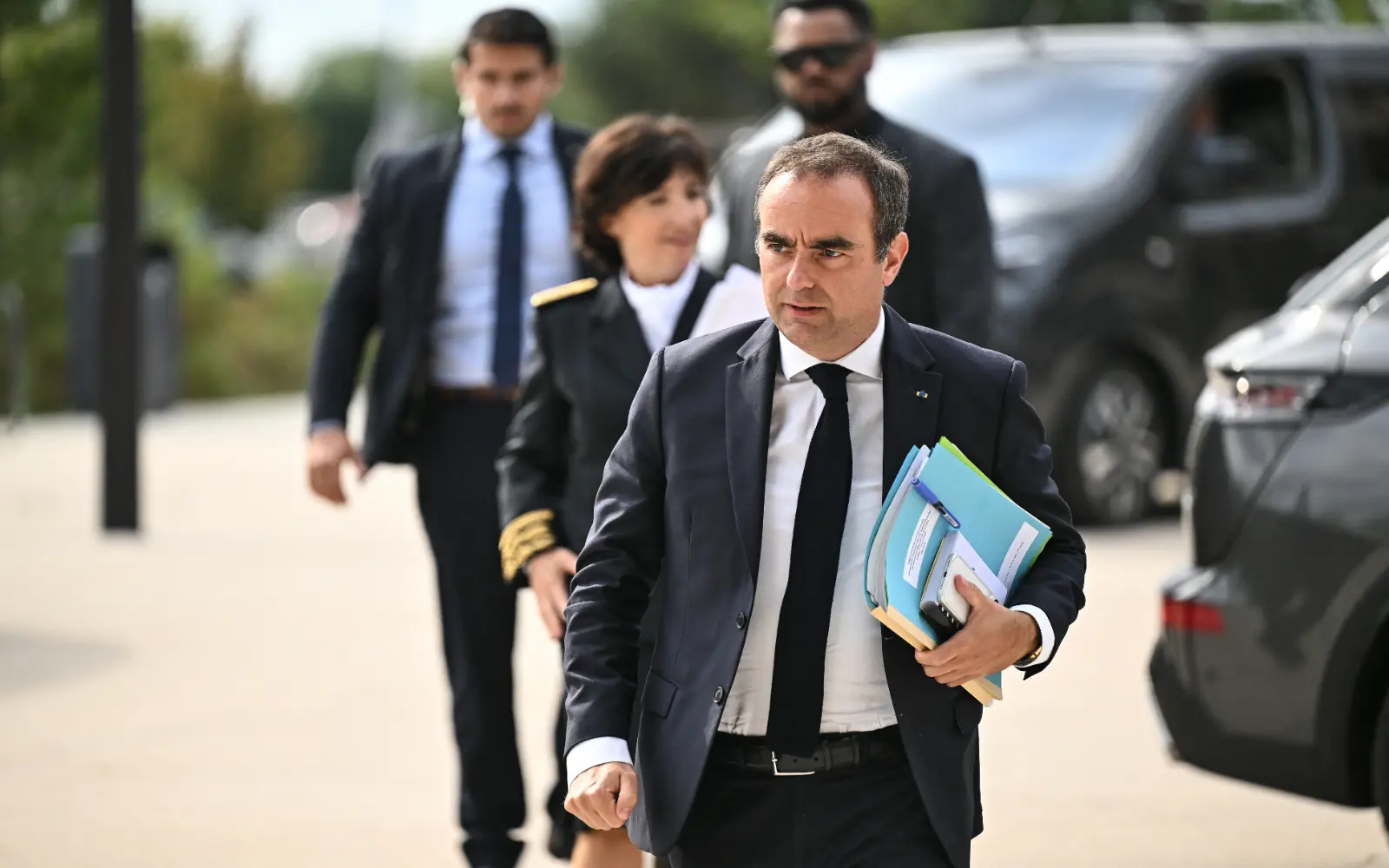 Residents jeer French PM on visit to fire-hit region