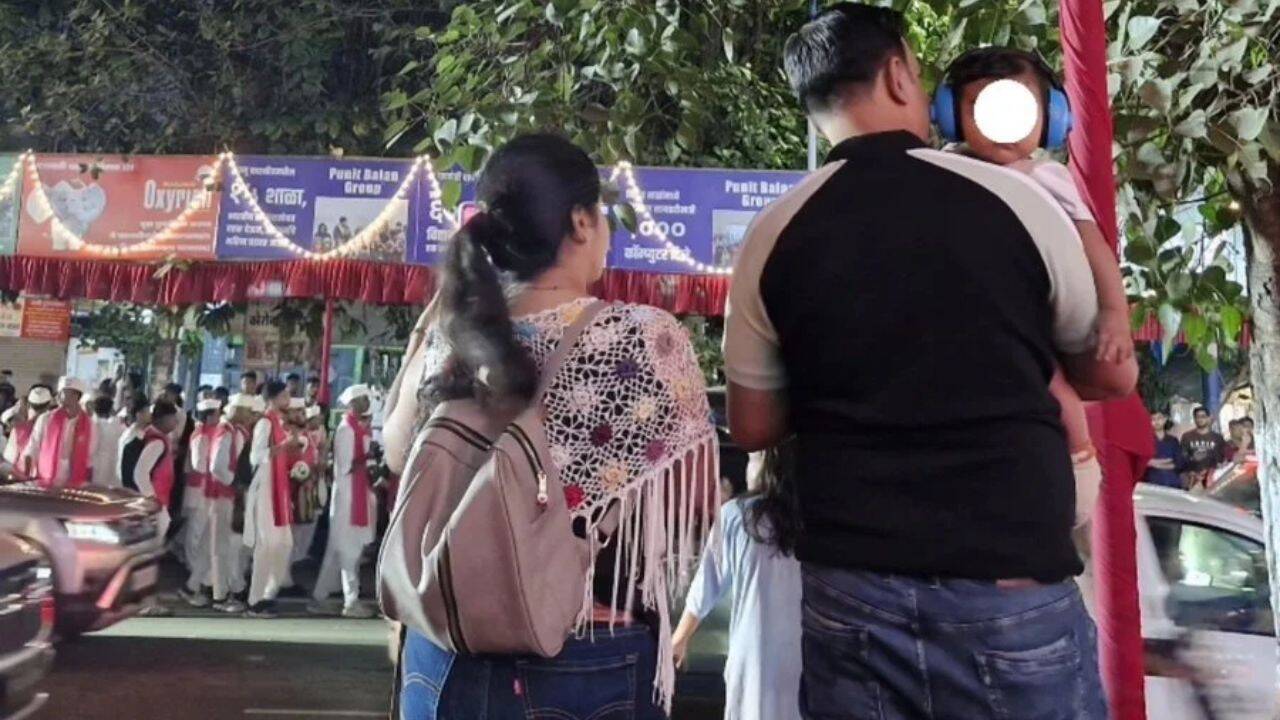 Pune parents praised for putting headphones on baby at dhol procession