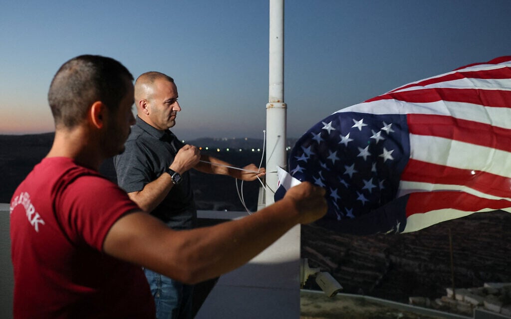 Palestinian-American raises US flag upon return to Qusra home besieged by settlers