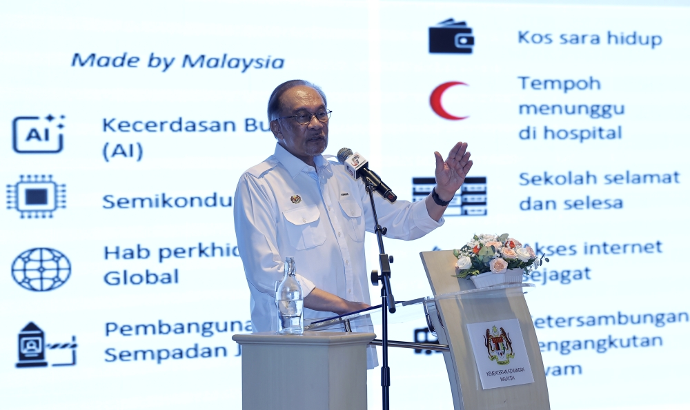 Which book says 1MDB debts are all paid? Anwar wants to know