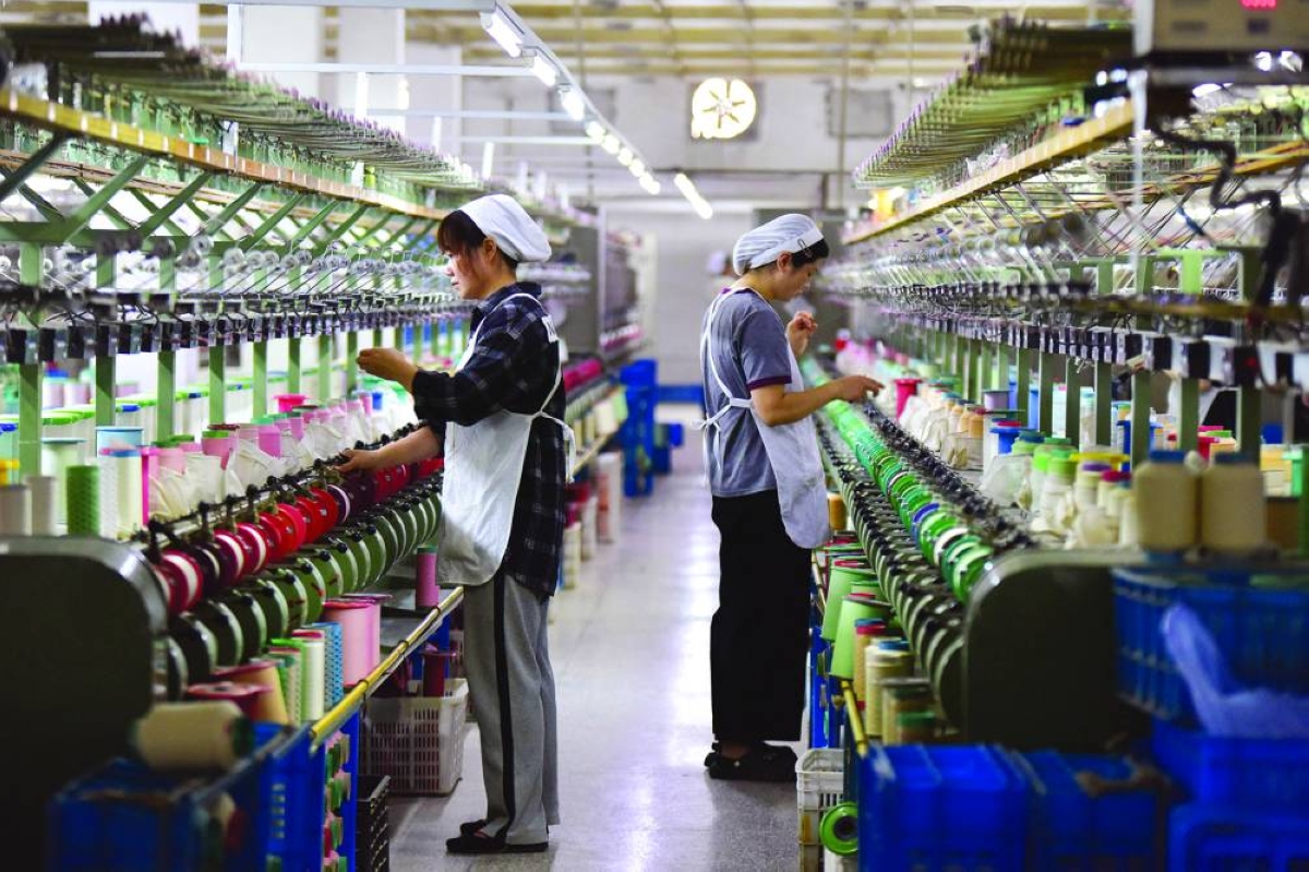 China's economic growth picks up as exports boom, consumers balk