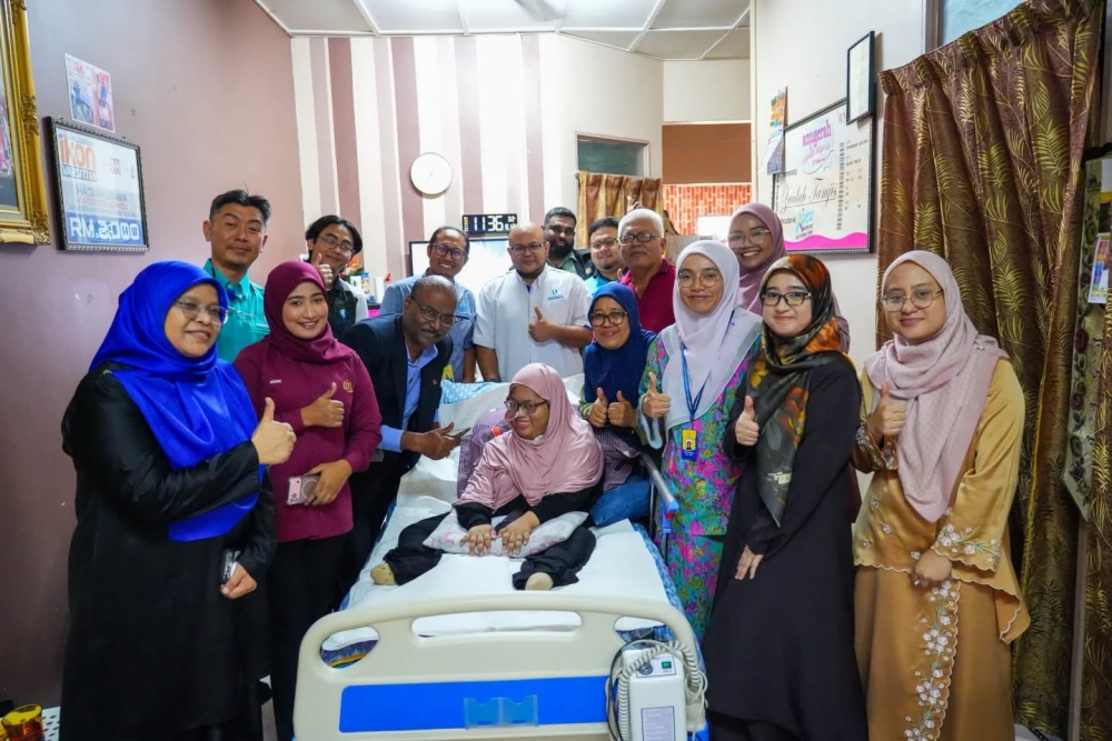Mother helps carry Siti Hawa through demanding PhD journey, while dealing with rare genetic disorder