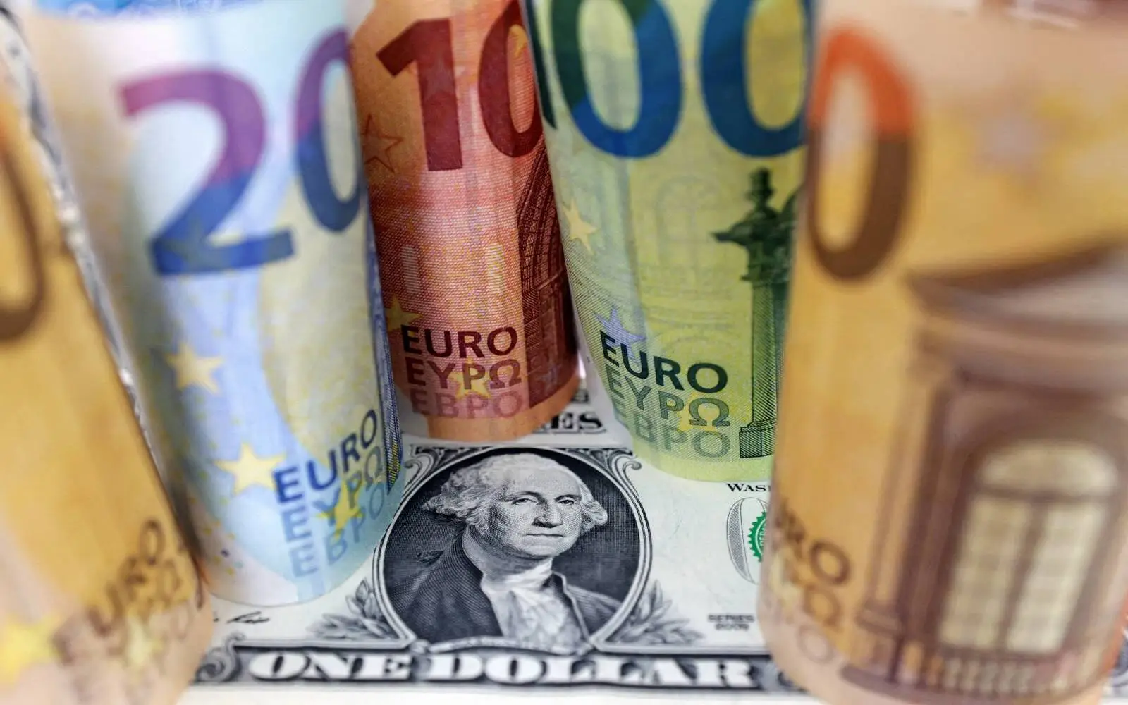 Dollar edges lower against euro as markets trim US rate hike bets
