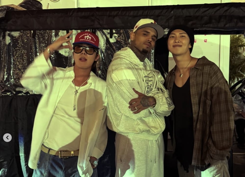 BTS fans divided after RM and J-hope pose with Chris Brown — as Jungkook and V also play his songs