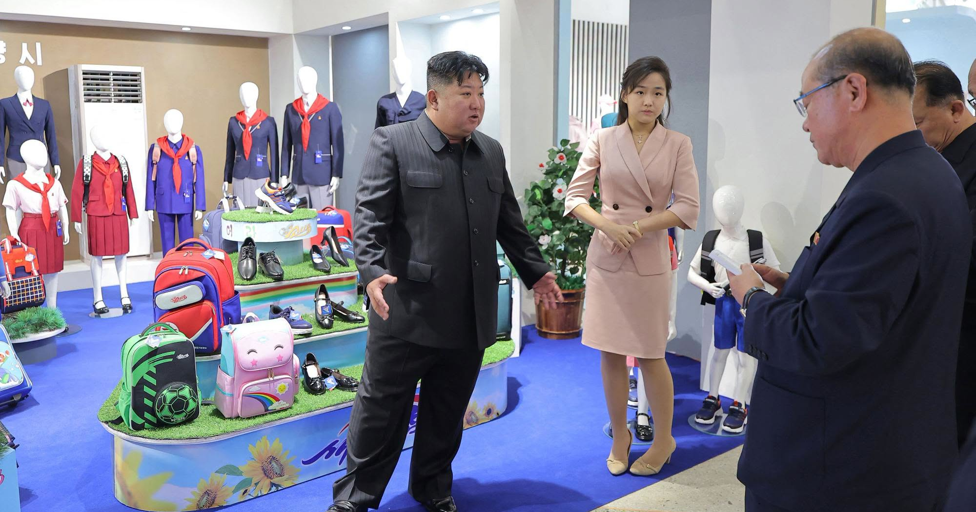North Korea releases Kim Jong Un looking at shoes & clothing photos following rumours of his death