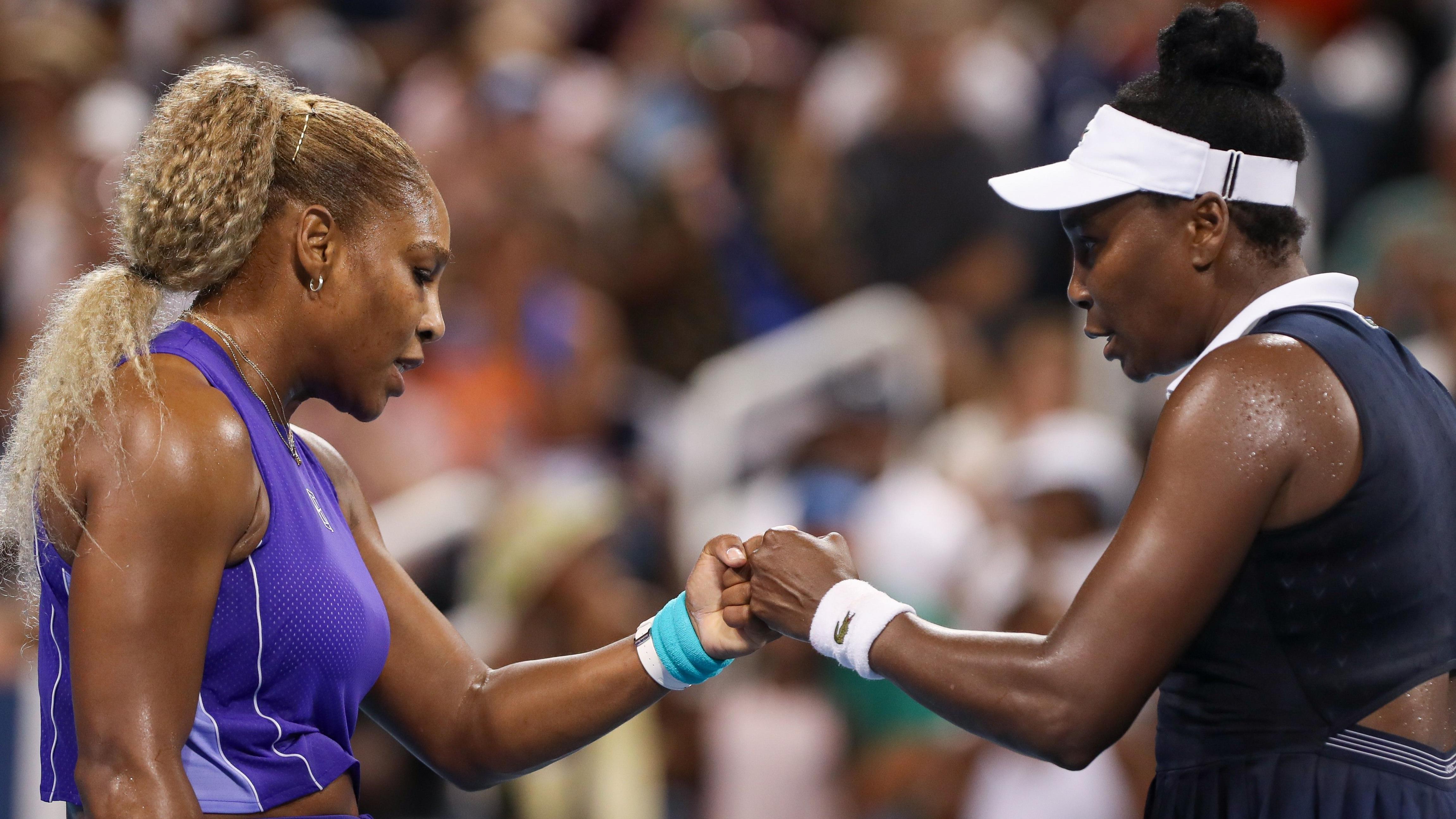 Williams sisters lose on doubles return